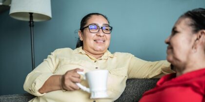 Two women chatting over a cup of tea